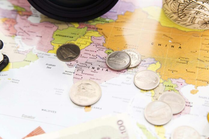 a bunch of coins sitting on top of a map